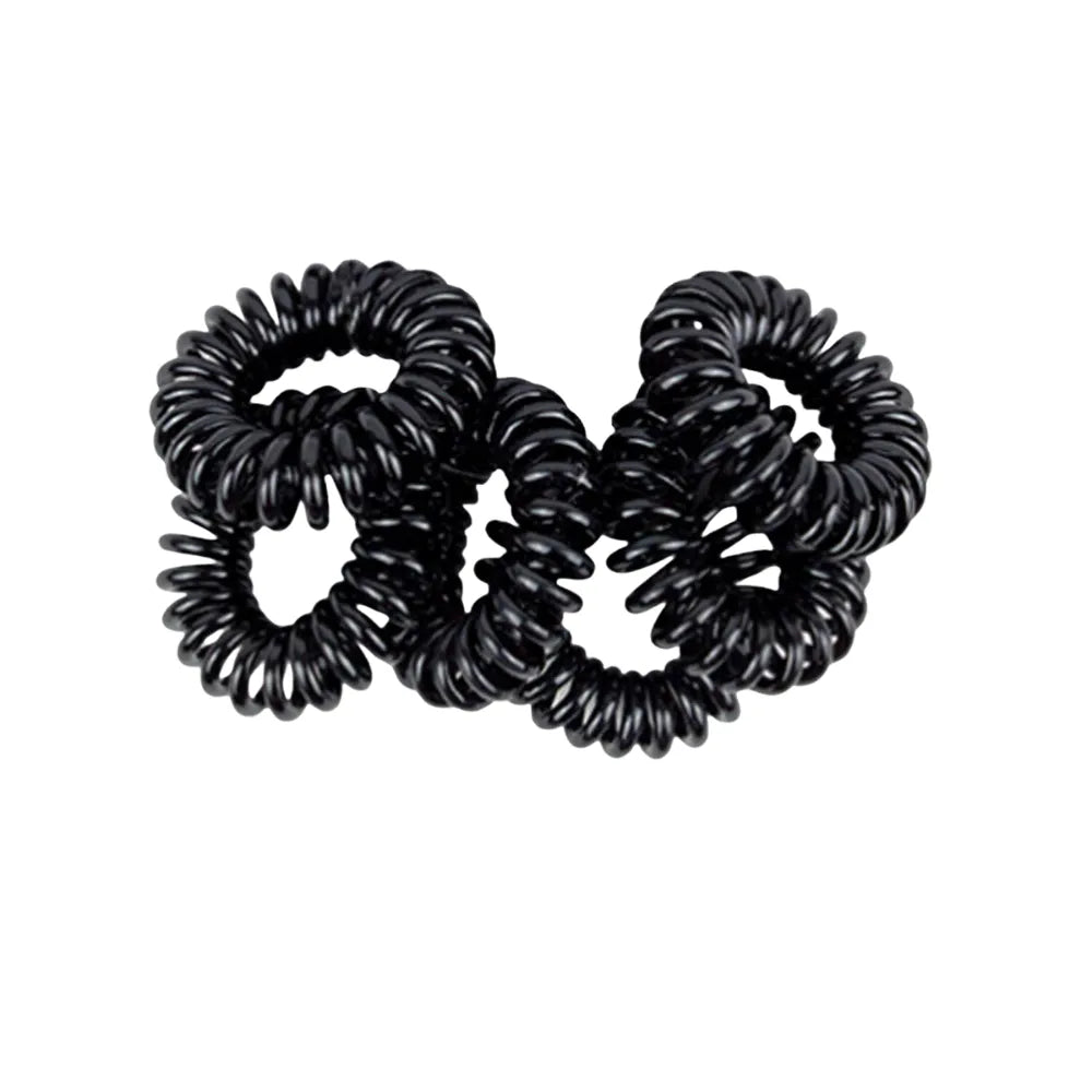Three black coiled hair ties on a white background