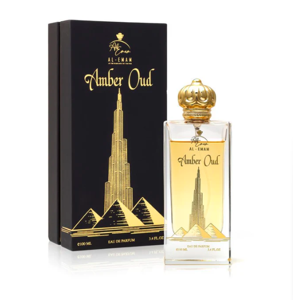 Amber Oud perfume bottle and packaging with Burj Khalifa design on a white background