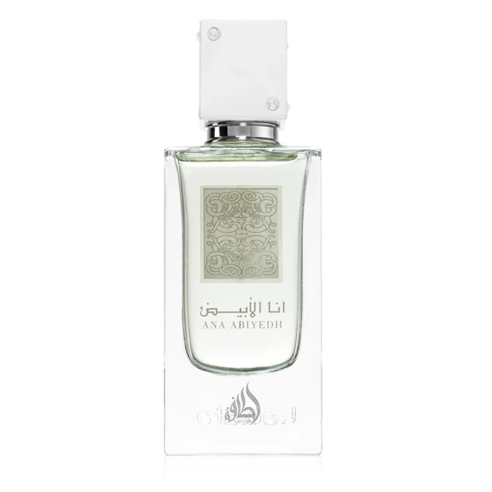 A clear glass perfume bottle with a white rectangular cap and a pale green decorative label, shown on a plain white background. The label includes Arabic script and the brand name 'ANA ABIYEDH'.
