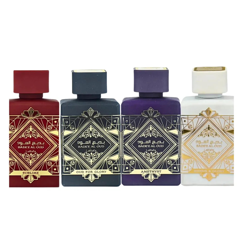 Four perfume bottles with decorative labels on a white background