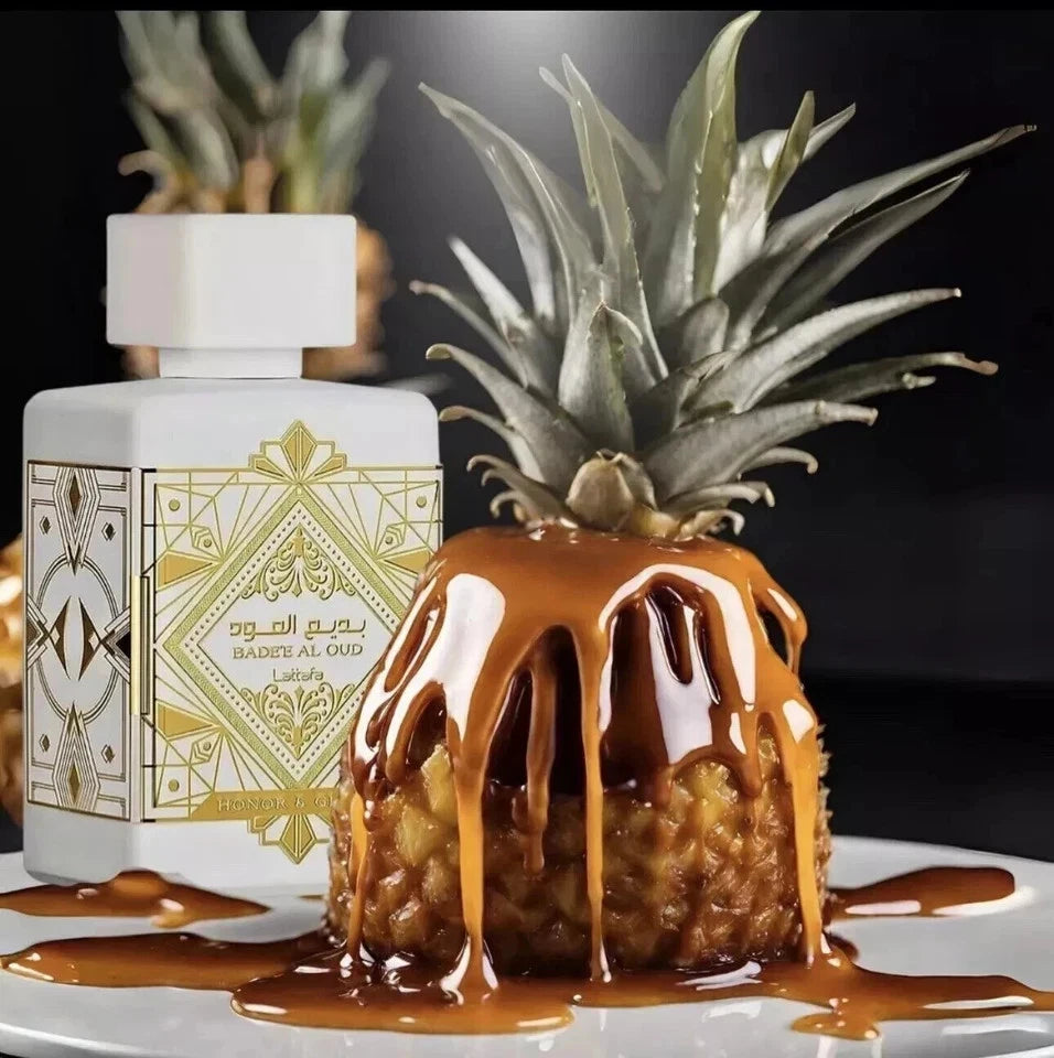 Perfume bottle with a caramel-drenched pineapple on a dark background