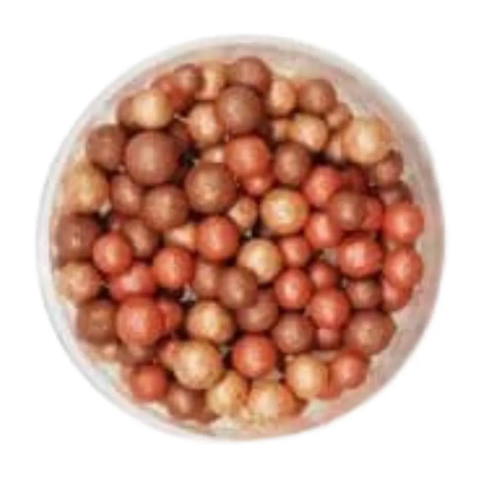 Assorted makeup pearls in a white container on a white background