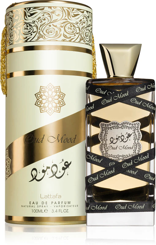 Eau de Parfum bottle and packaging with intricate designs on a white background
