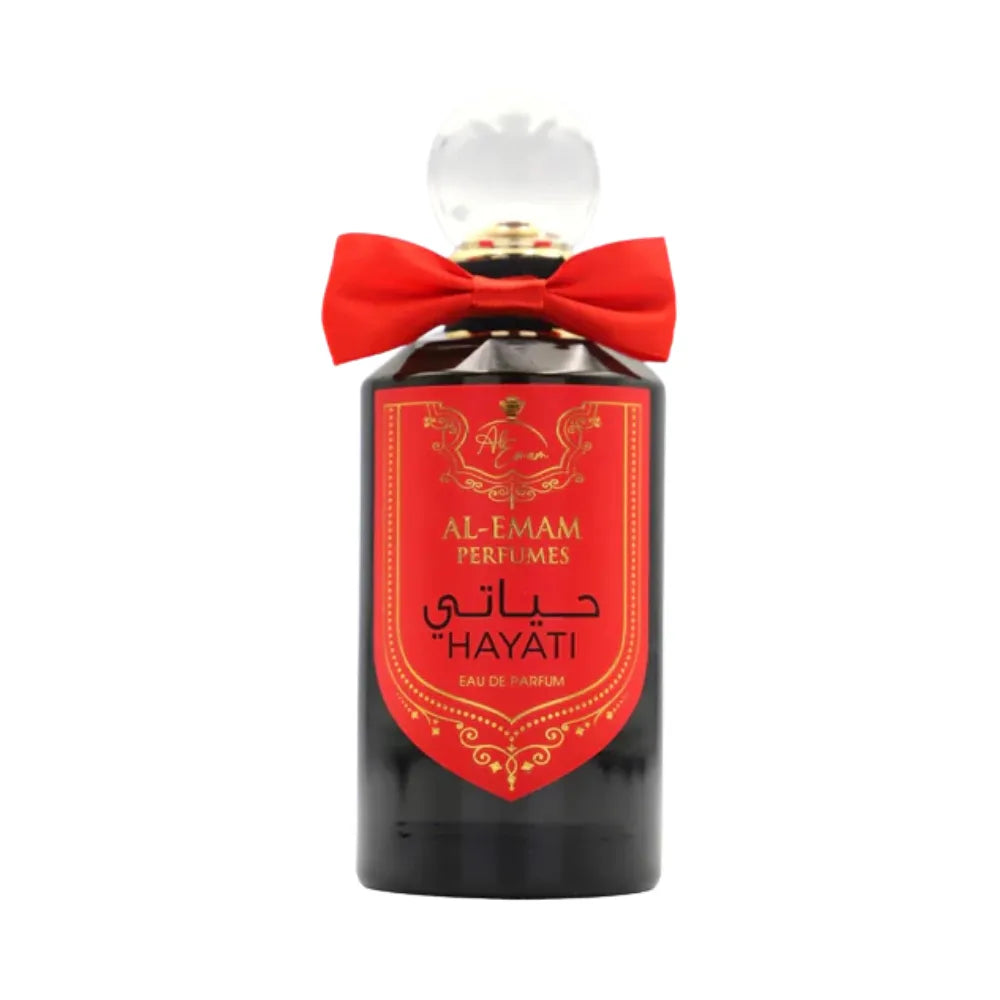 Perfume bottle with a red bow on a white background