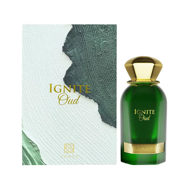 Green perfume bottle with gold cap and 'Ignite Oud' text next to its packaging on a white background