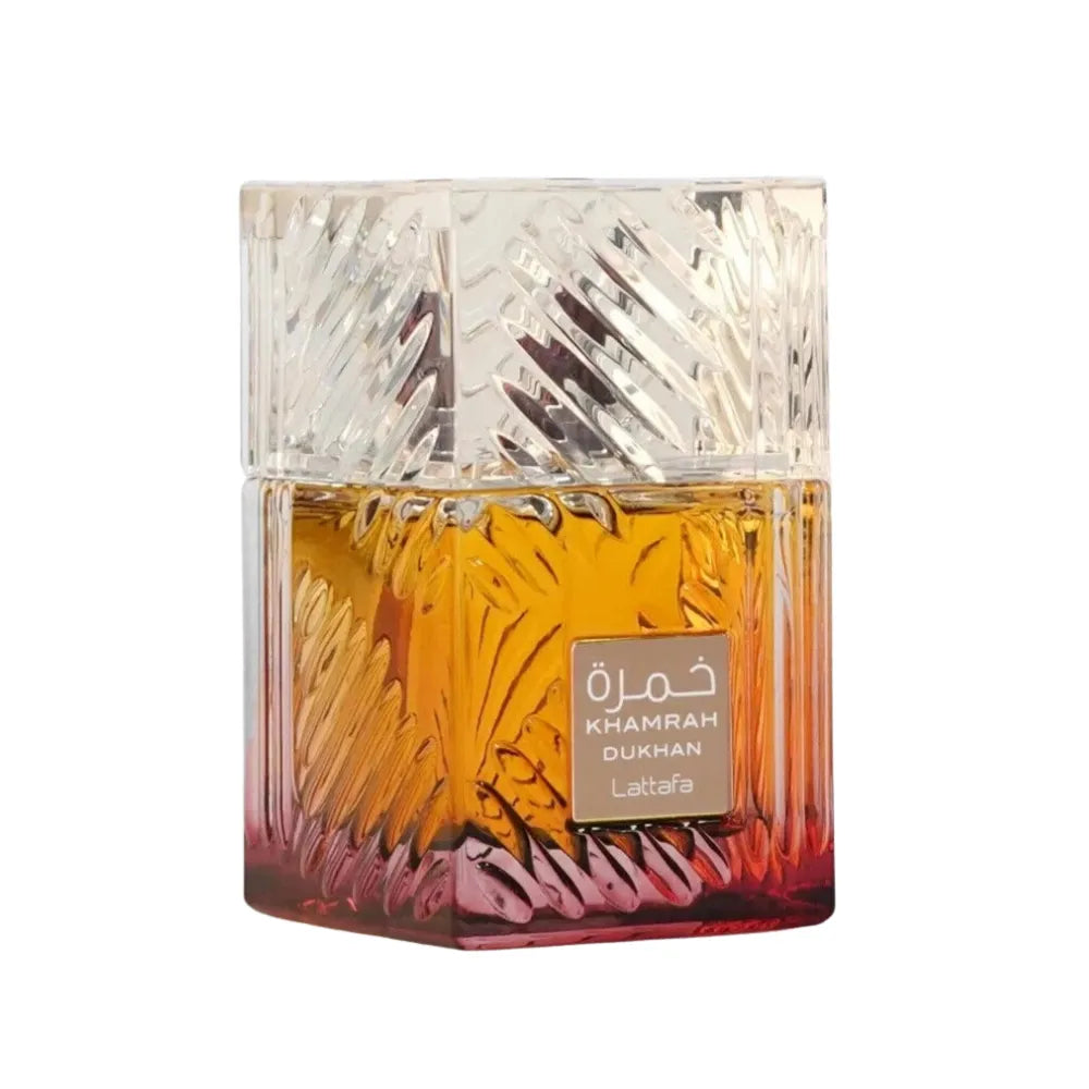 Decorative glass container with intricate designs on a white background