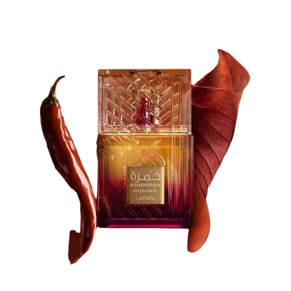 Decorative bottle with a red leaf and a chili pepper on a white background