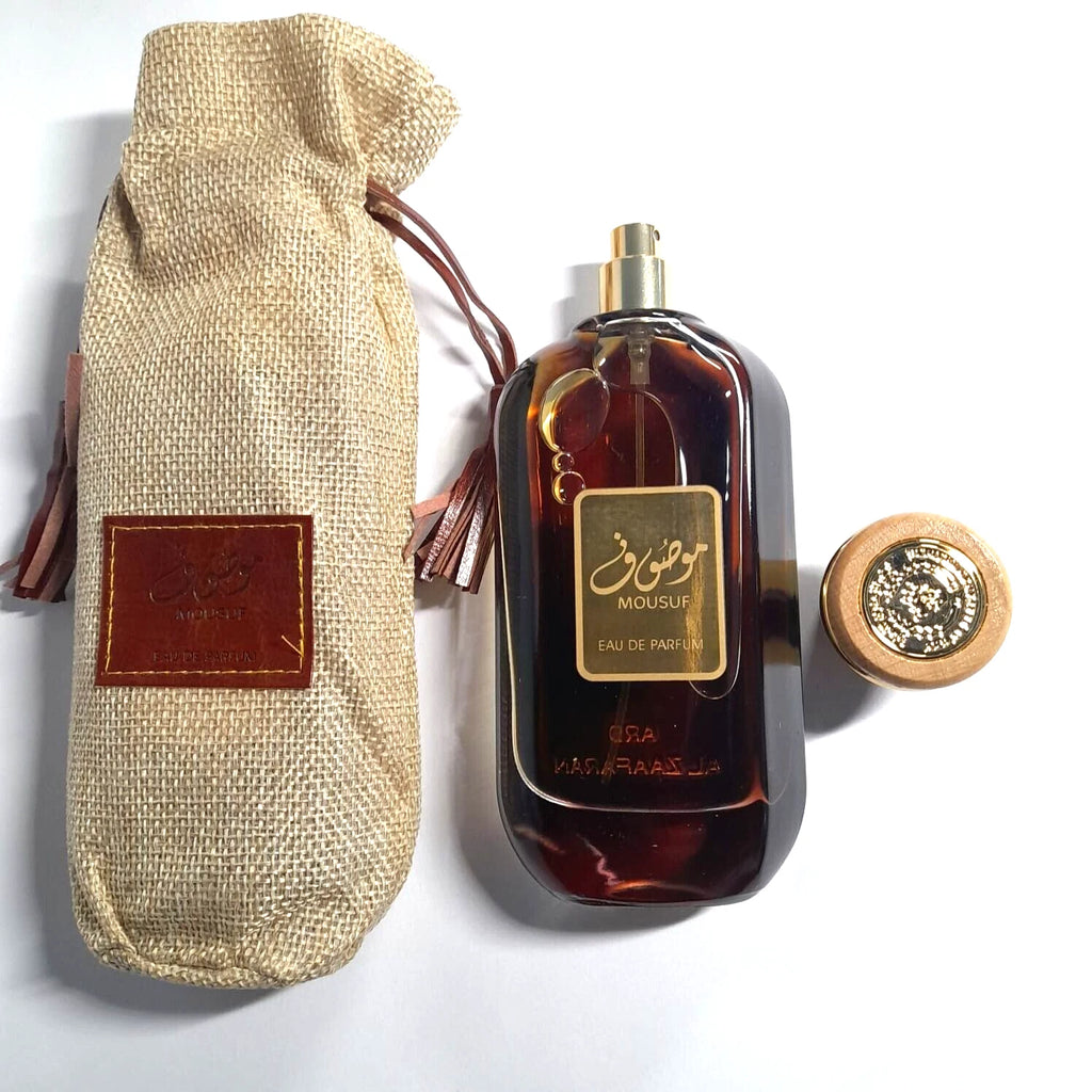 Mousou perfume bottle with a textured bag on a white background