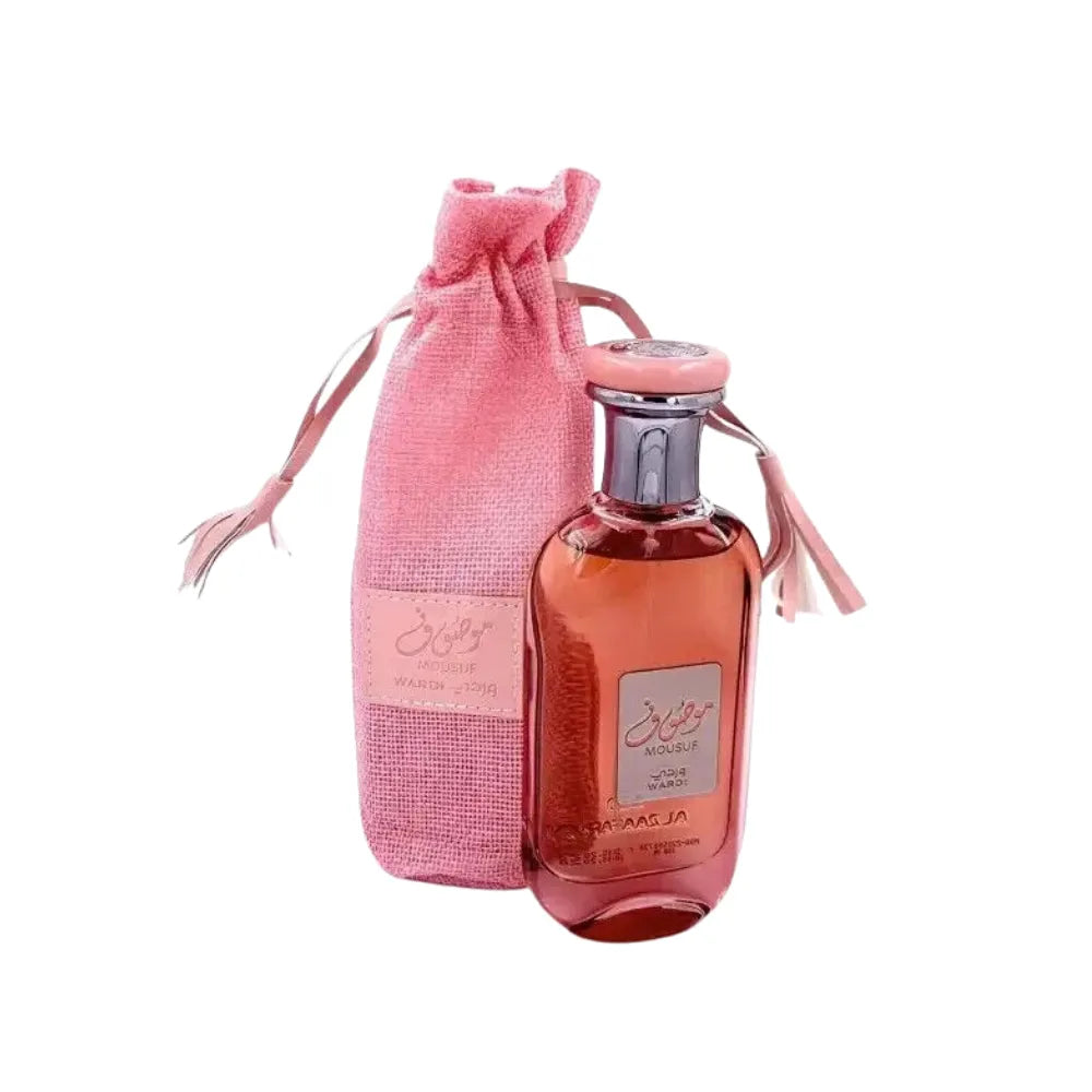 Pink perfume bottle with a matching drawstring bag on a white background