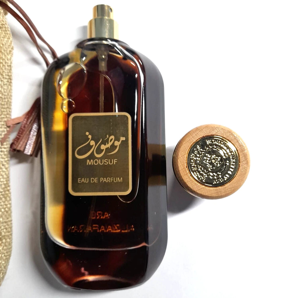 Mousuf Eau de Parfum bottle with gold cap on a white background
