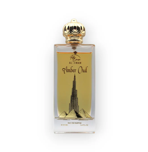 Perfume bottle with gold cap and label featuring a building design on a white background