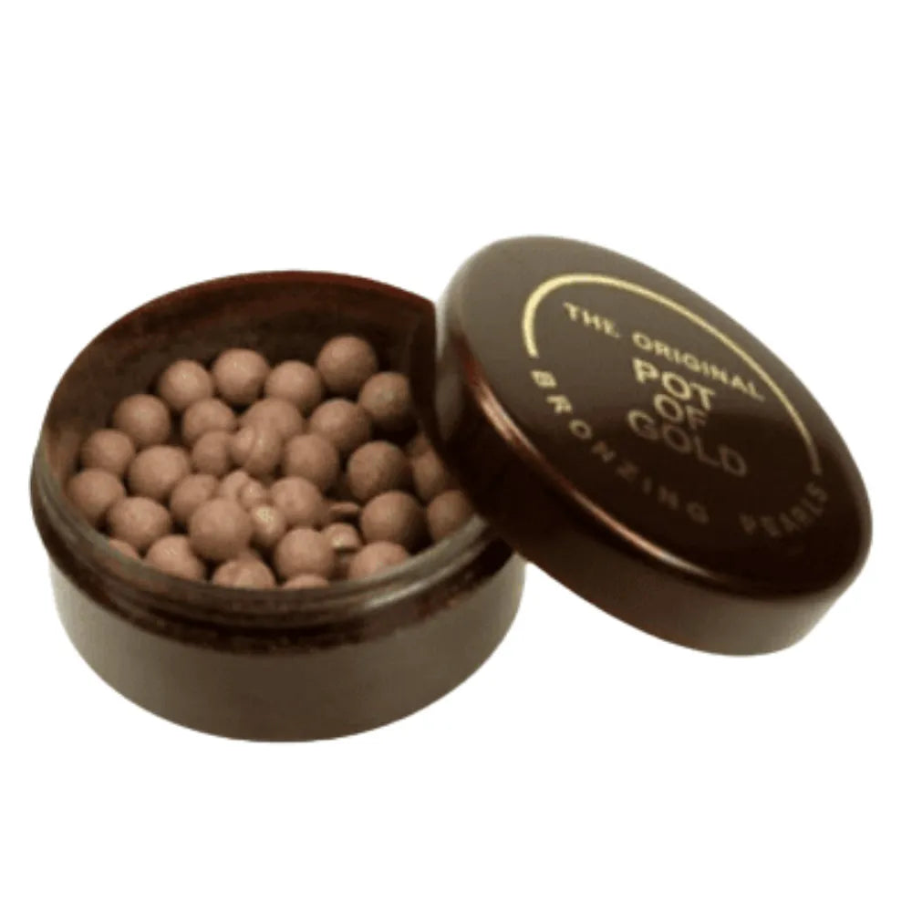 Open container of 'The Original Pot of Gold Bronzing Pearls' on a white background