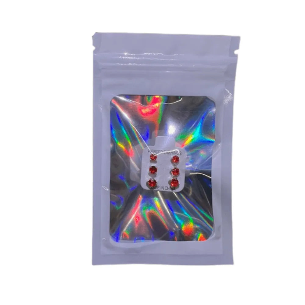 Transparent packaging with colorful reflections containing a small object on a white background