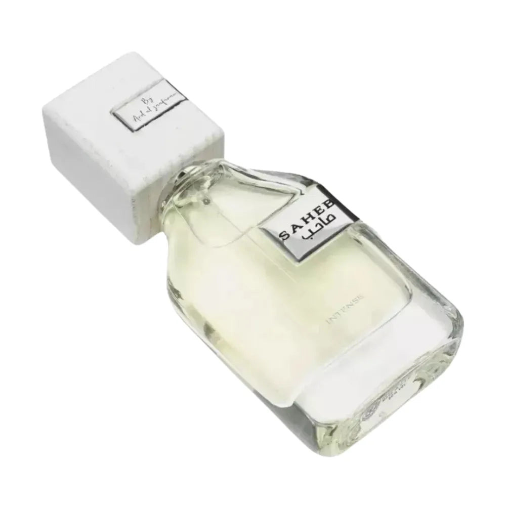 Perfume bottle with white cap and clear body on a white background