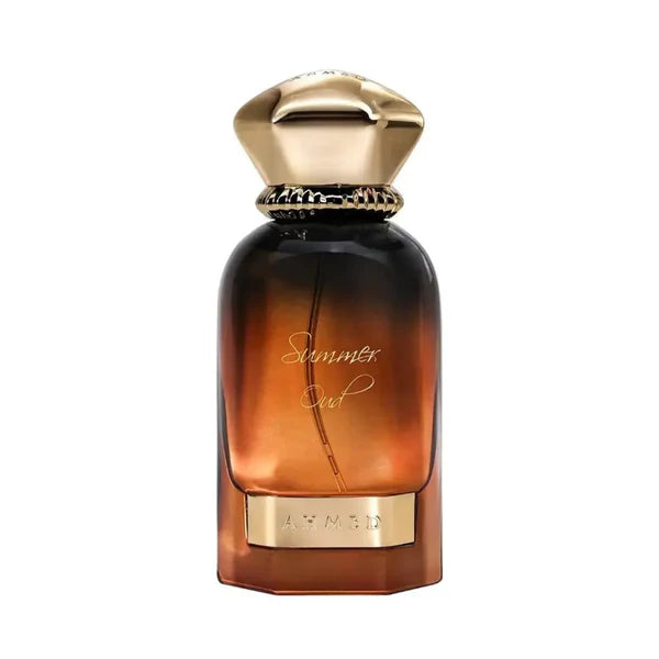 Perfume bottle with gold cap and base on a white background