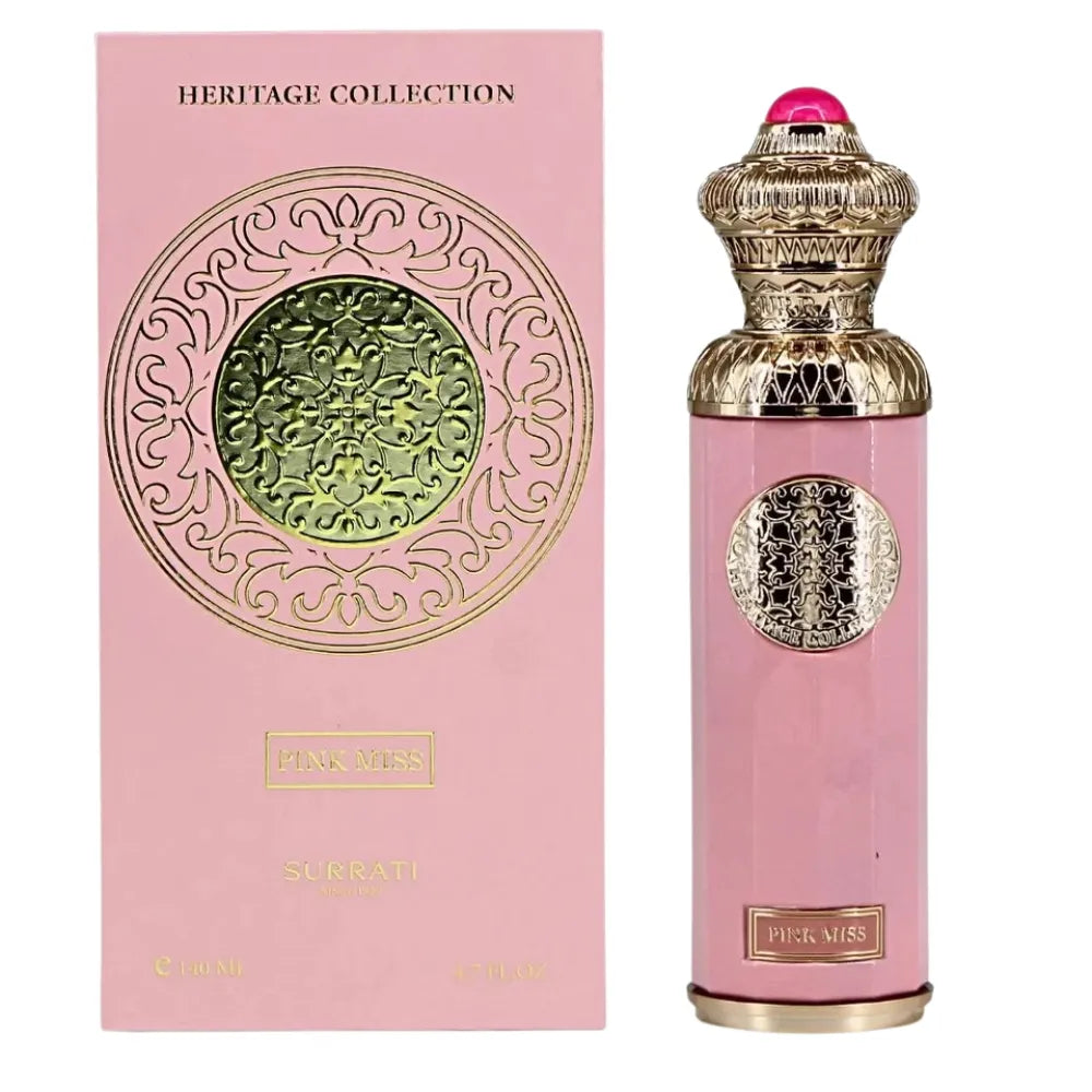 Pink perfume bottle with gold accents and decorative packaging on a white background