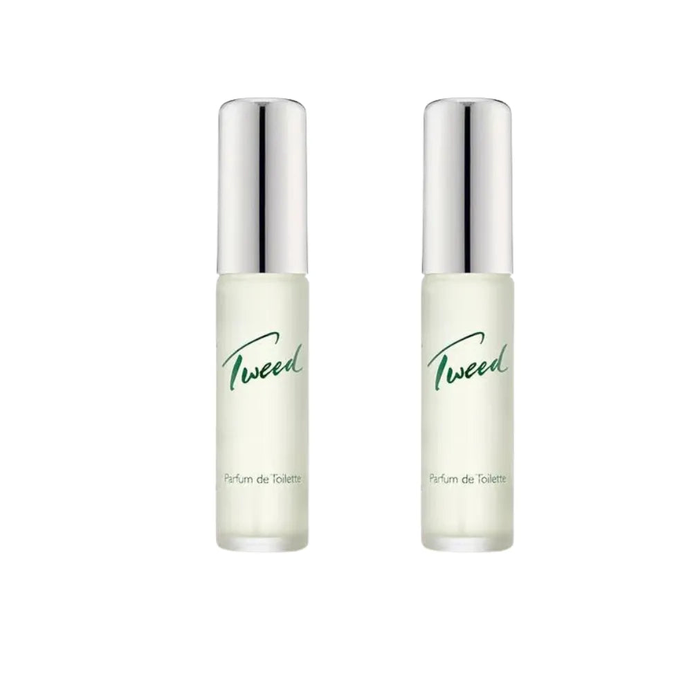 Two bottles of Tweed perfume with silver caps on a white background
