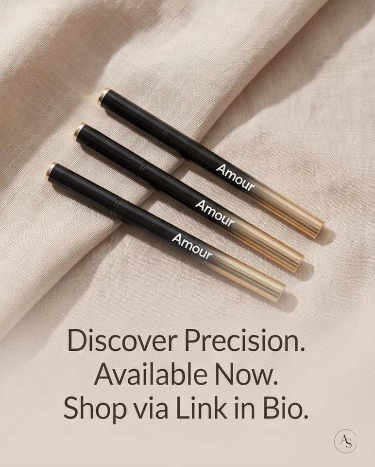 Two 'Amour' branded eyeliner pens on a marble surface 2