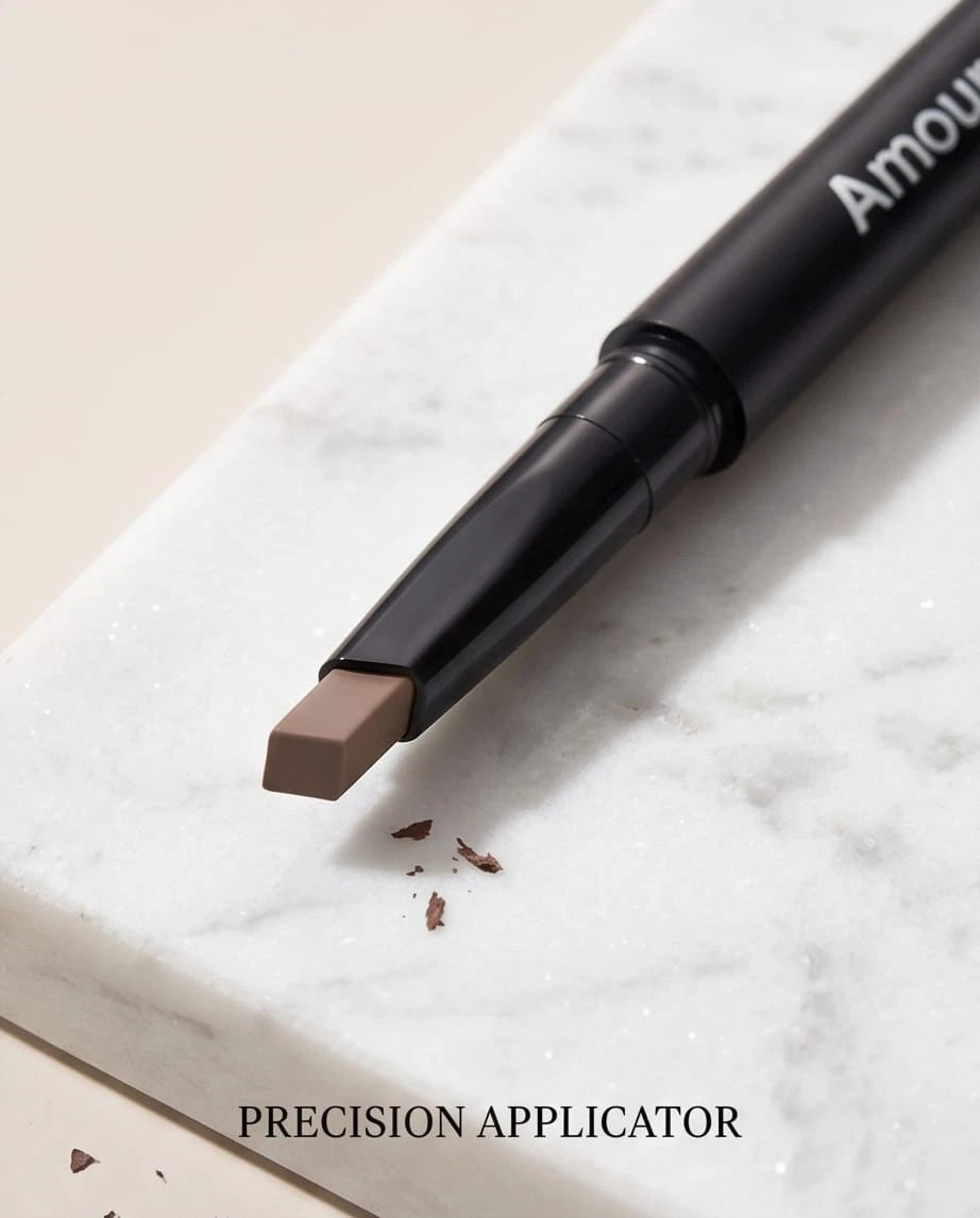 Amour eyebrow pencil with precision applicator on a marble surface