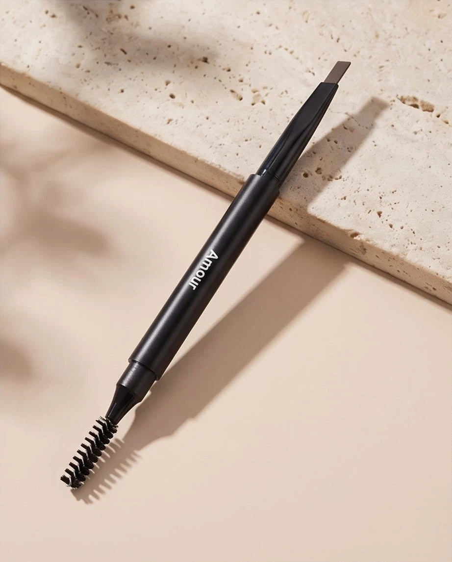 Black eyebrow pencil on a beige surface