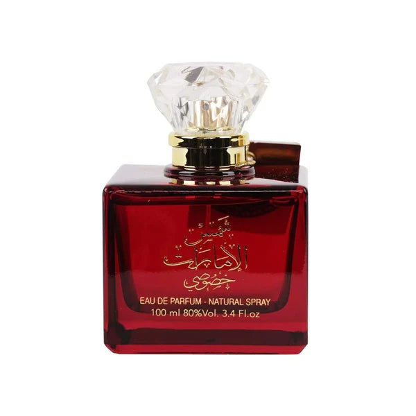 Red perfume bottle with a diamond-shaped cap on a white background