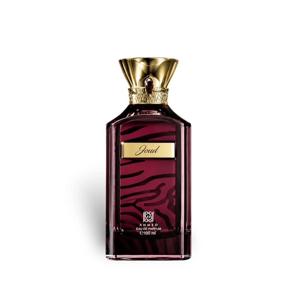 Perfume bottle with gold cap and maroon design on a white background