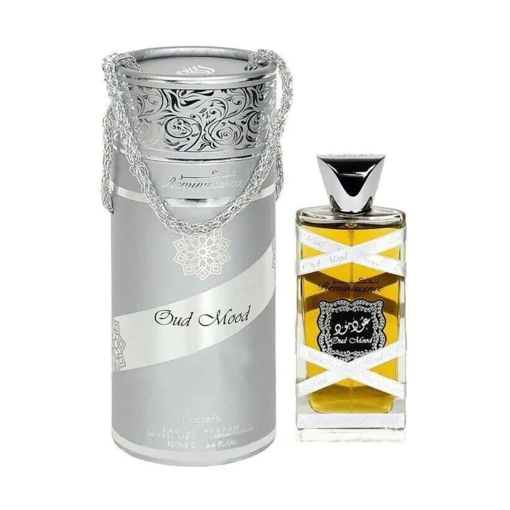Perfume bottle and packaging with intricate design on a white background