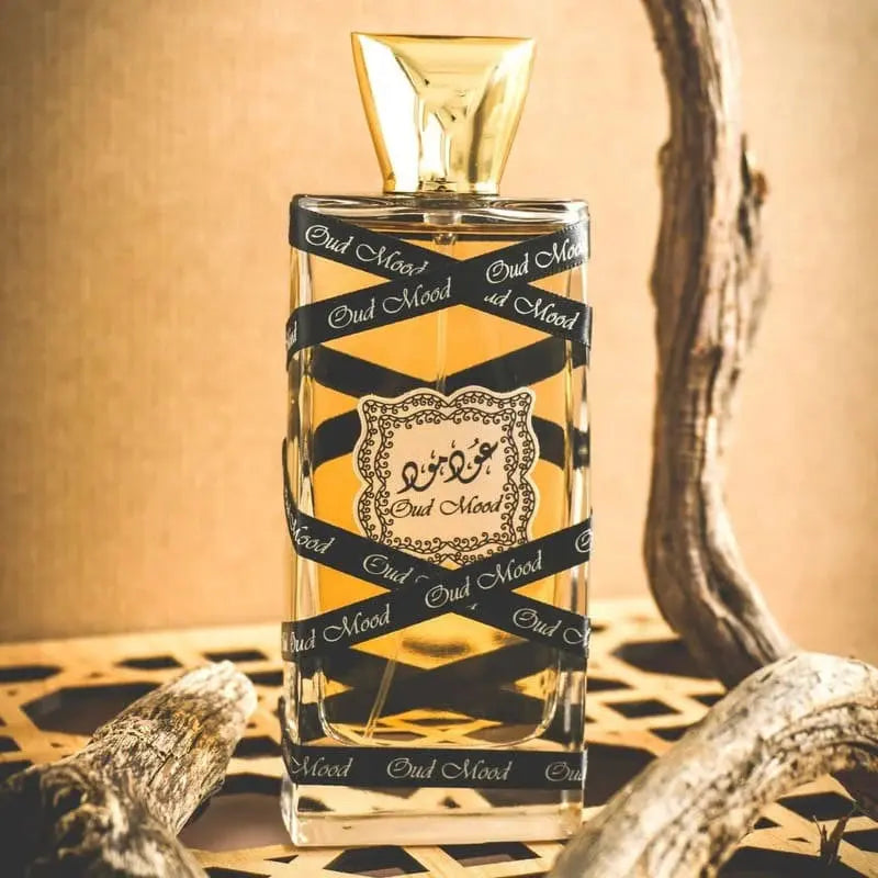 Perfume bottle with decorative label on a textured surface