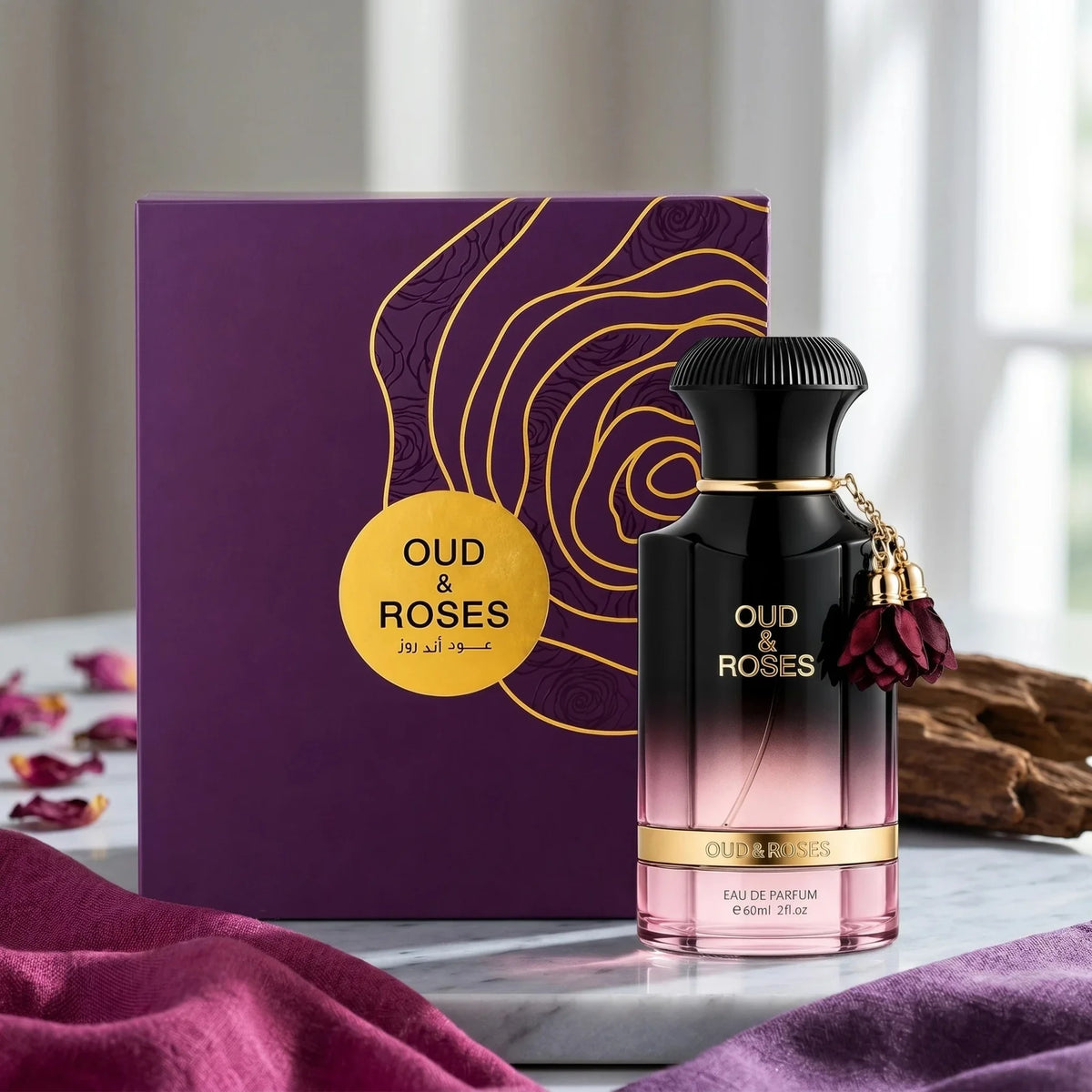 Oud & Roses perfume bottle with packaging on a marble surface